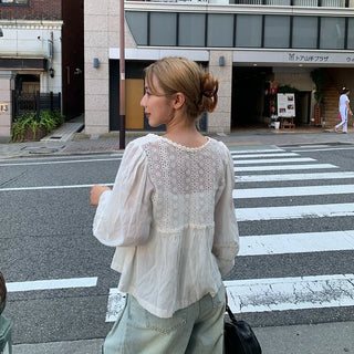 Punched open ribbon blouse