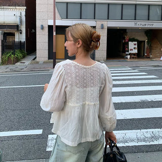 Punched open ribbon blouse