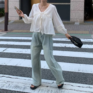 Punched open ribbon blouse