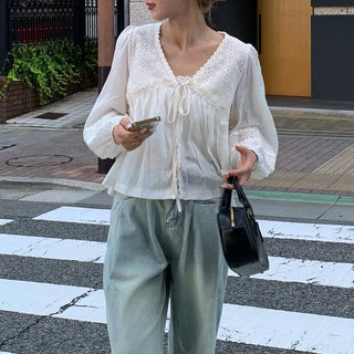Punched open ribbon blouse
