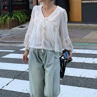 Punched open ribbon blouse