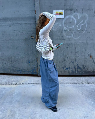 Black button-up elastic waist parachute pants