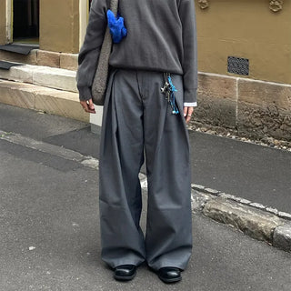 Wide-leg slacks with side pleats