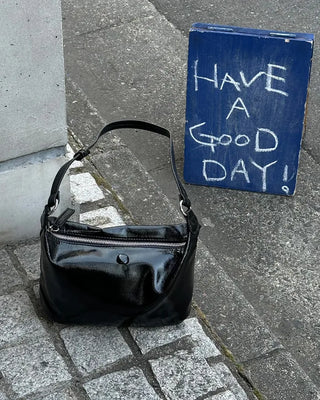 Round enamel shoulder bag