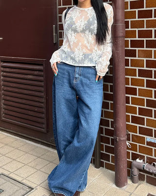 Wide-leg jeans with faded whisker wash.