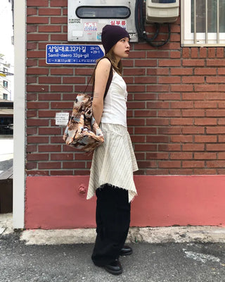 Unique strap cut-off midi skirt