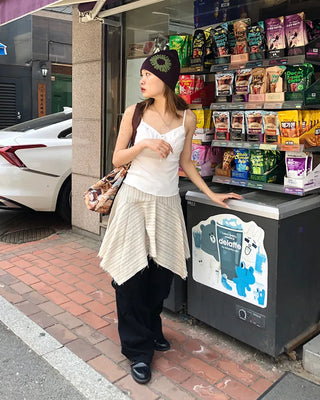 Unique strap cut-off midi skirt