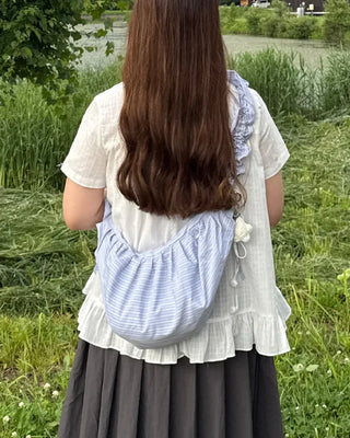 Striped half-moon shirred bag