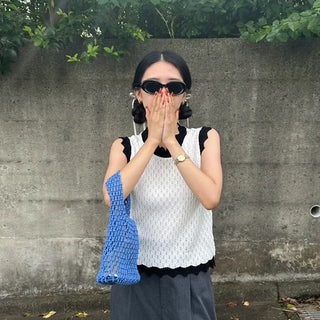 Two-tone perforated sleeveless knit