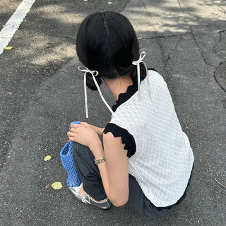 Two-tone perforated sleeveless knit