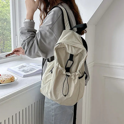 Nylon backpack with waist drawstring pockets