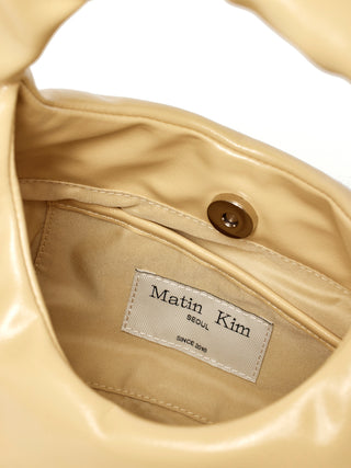 EMBOSSED LOGO LEATHER MINI TOTE BAG IN LIGHT YELLOW