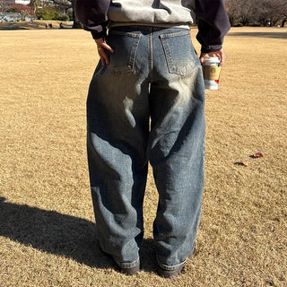 Pleated wide-leg denim pants