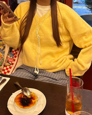 V-neck ribbed hem loose sweater