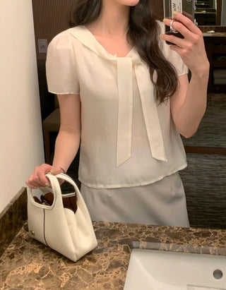 Short-sleeved blouse with tie