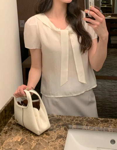 Short-sleeved blouse with tie