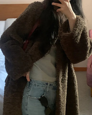 Collarless boucle fur coat