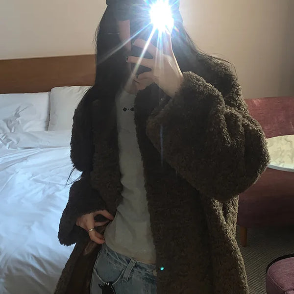 Collarless boucle fur coat