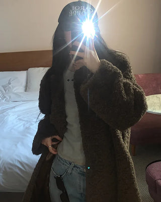 Collarless boucle fur coat