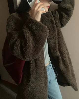Collarless boucle fur coat