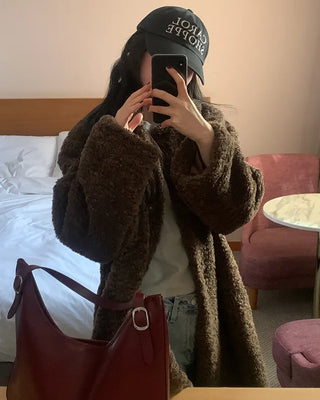 Collarless boucle fur coat