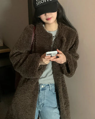 Collarless boucle fur coat