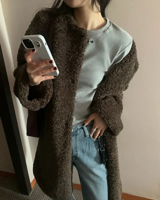 Collarless boucle fur coat