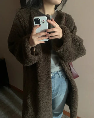Collarless boucle fur coat