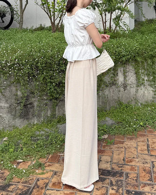 Two-button strap slacks