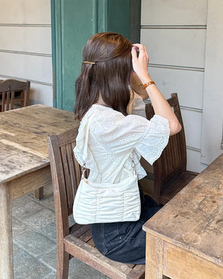 Punched ruffle blouse