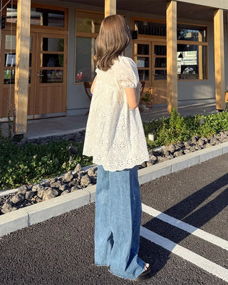 High-waisted denim pants with button strings