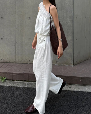 Asymmetrical ruffled sleeveless blouse