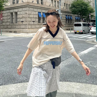 Pleated check midi skirt
