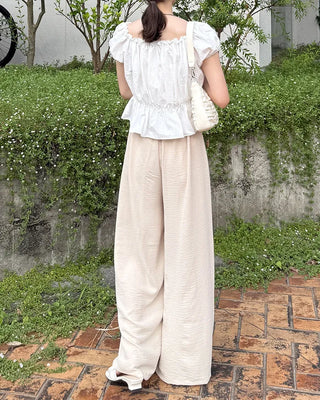 Two-button strap slacks