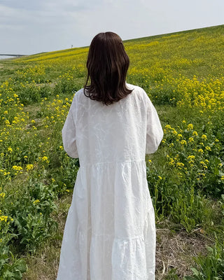 Long dress with neck lace detail and ruffles