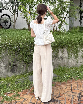 Two-button strap slacks