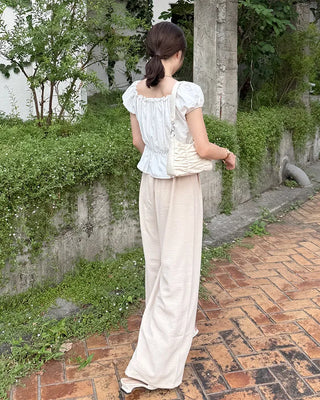 Two-button strap slacks