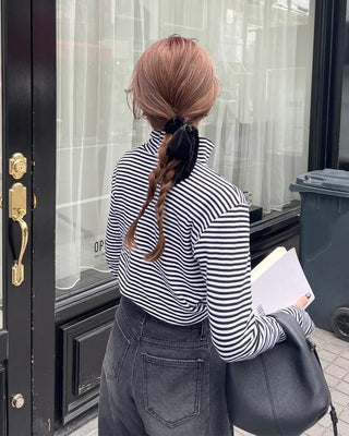 Striped half-turtleneck cut and sew