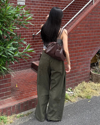 Side-tucked white cotton pants