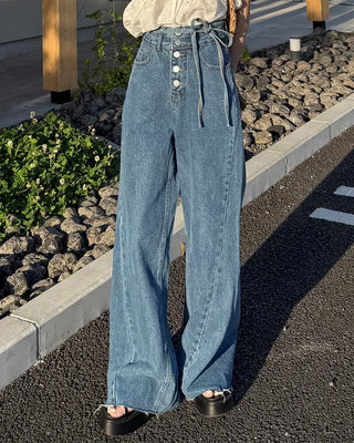 High-waisted denim pants with button strings