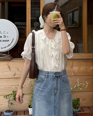 Pintuck ruffle bow tie blouse