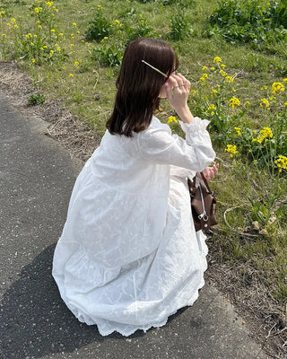 Long dress with neck lace detail and ruffles