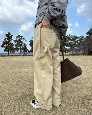 Cotton pants with side buckle patches