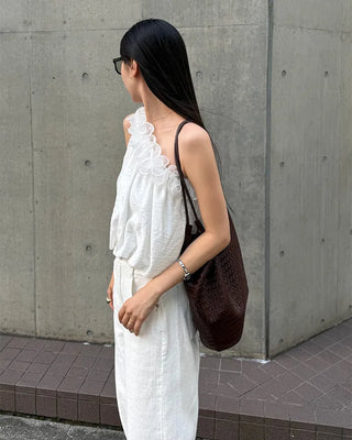 Asymmetrical ruffled sleeveless blouse