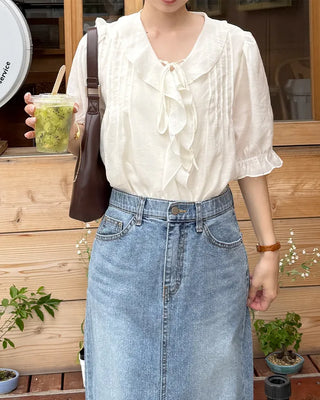 Pintuck ruffle bow tie blouse