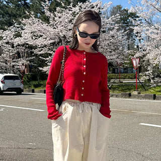 Round punching cardigan