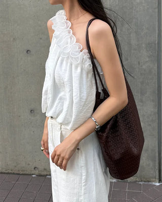 Asymmetrical ruffled sleeveless blouse