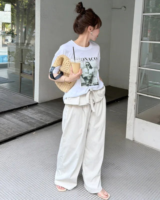 Wide-leg pants with pleats and peplum belt