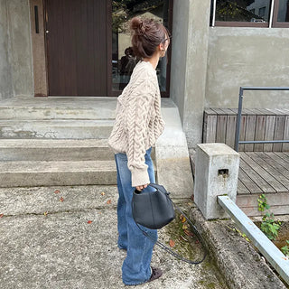 Loose-fitting cable knit round neck sweater