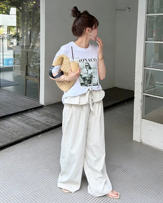 Wide-leg pants with pleats and peplum belt